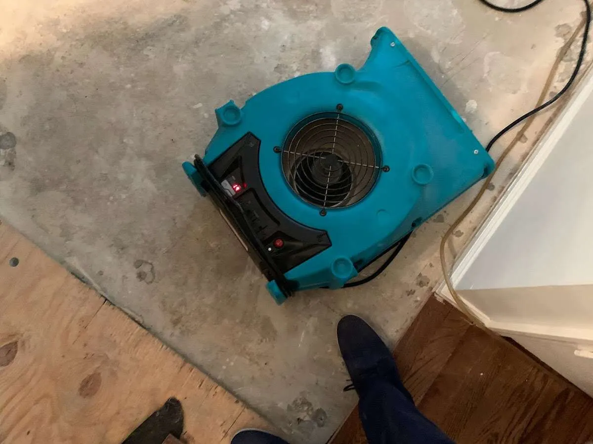 Air mover drying subfloor during Leak Detection & Repair in Hinsdale